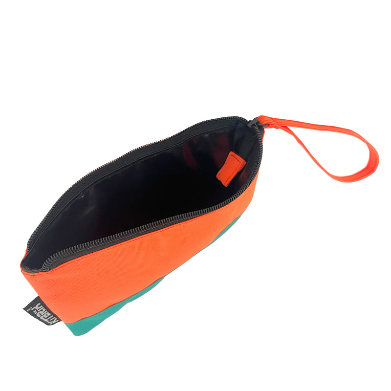 Compact and stylish duo-color pouch with a convenient wrist strap for handkerchief storage.