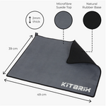 This is a KitBrix mat. It measures 49 cm in length and 39 cm in width, and is 2mm thick. The top surface is made of microfibre suede, while the base is natural rubber. It's a practical and well - constructed mat suitable for various uses.